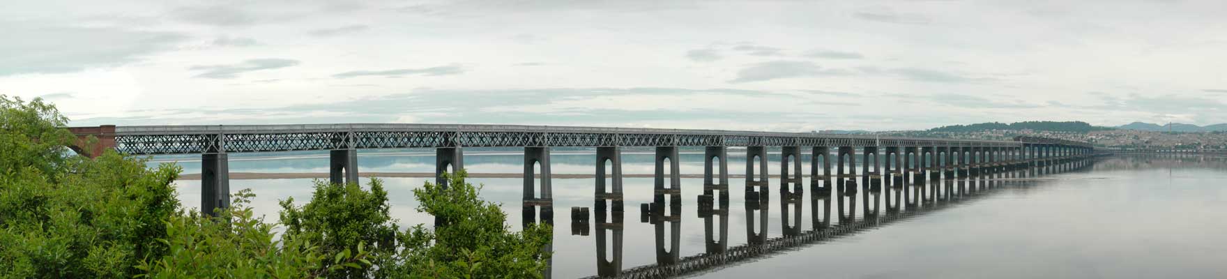 Calm water gives a perfect reflection of the bridge